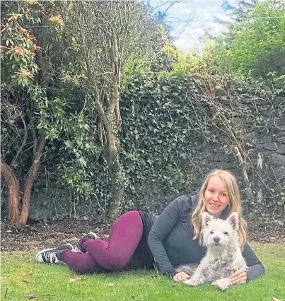  ??  ?? TREK: Seonaidh, pictured with her dog Hamish, cycled 546 miles – the distance between Aberdeen and London