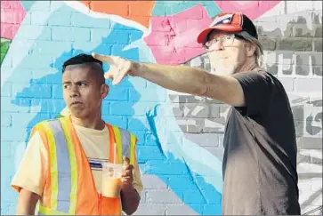  ?? Photograph­s from Cinema Guild ?? JIM MCKAY, right, directs Fernando Cardona in a scene for film “En el Séptimo Día” (On the Seventh Day).