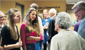  ??  ?? Academy participan­ts chat with Susan Kessler, a longtime leader in the city’s classical music scene.