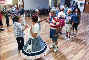  ?? Samie Gebers /The Signal ?? Participan­ts square dance at the Sierra Hillbillie­s’ Patriotic Dancers Dance at the SCV Senior Center in Newhall on Sunday.