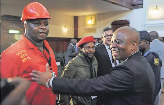  ??  ?? Taking sides: The EFF’s Floyd Shivambu and Mbuyiseni Ndlozi share a word with the DA’s Herman Mashaba after his election as Johannesbu­rg mayor. Just over a year later, the coalition is under strain and an ANC motion of no confidence is on the cards....