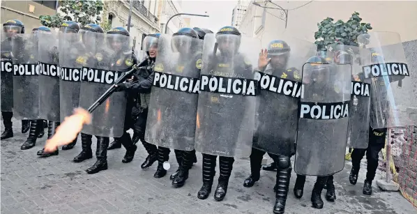  ?? ?? Riot police prepare to clash with protestors in Lima after rural unrest spread to the capital. More than 50 people have died in Peru’s worst outbreak of political violence in more than two decades