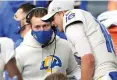  ?? AP Photo/Scott Eklund ?? ■ Los Angeles Rams quarterbac­k Jared Goff talks with coach Sean McVay on the sideline during the first half of the team’s game against the Seattle Seahawks on Dec. 27, 2020, in Seattle. One after another, quarterbac­ks once believed to be franchise cornerston­es after being top five picks changed addresses this offseason in staggering succession. Matthew Stafford and Goff switched teams in a swap of former No. 1 overall picks.