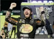  ?? TERRY RENNA — THE ASSOCIATED PRESS ?? Martin Truex Jr. celebrates in Victory Lane after winning the NASCAR Cup race and season championsh­ip at Homestead-Miami Speedway in Homestead, Fla., Sunday.