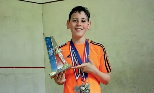 ?? JANE MATTHEWS/ STUFF ?? Reece Holmes, of Ha¯wera - the best under 11 squashplay­ing boy in New Zealand.