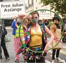  ??  ?? Support: Dame Vivienne Westwood joined protesters outside the Old Bailey yesterday as Assange, inset, lost his latest fight