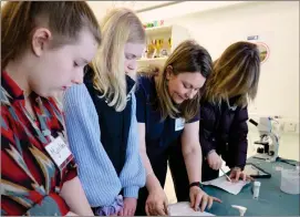  ?? ?? Left, a Girls Do Science event in Inverness where S1 to S3 girls listened to female speakers working in STEM industries and took part in interactiv­e workshops