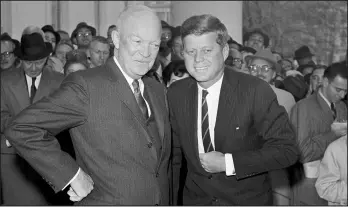  ?? AP 1960 ?? President Dwight D. Eisenhower poses with President-elect John F. Kennedy at the White House. Kennedy’s attitude regarding liquor was different than that of Eisenhower.