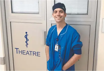  ??  ?? HEALTHCARE HERO: Theatre nurse graduate Jonathan Kraegel settles in for 12 months intensive training at St Andrew’s Hospital.