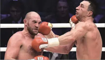  ??  ?? Tyson Fury lands deadly punch on Klitschko