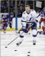  ?? THE ASSOCIATED PRESS ?? Tampa Bay Lightning center Steven Stamkos (91) warms up before playing against the Rangers last Friday.