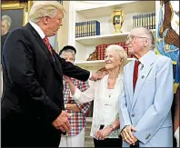  ?? AP/ALEX BRANDON ?? President Donald Trump greets Velma Stratton and USS Arizona survivor Donald Stratton during a meeting Friday in the Oval Office with survivors of the Dec. 7, 1941, attack at Pearl Harbor. Stratton is one of two men who attribute their survival to an...