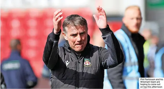  ?? ?? Phil Parkinson and his Wrexham team are hoping to come out on top this afternoon