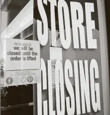  ?? Elizabeth Conley / Staff file photo ?? This sign was being displayed in the window of one of Houston’s Palais Royal stores in March.