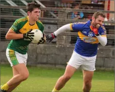  ??  ?? Seán Kenny breaks clear of Conor Cafferkey of St. Mary’s (Rosslare).