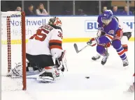  ?? Al Bello / Getty Images ?? The Rangers’ Jimmy Vesey shoots against Devils goalie Cory Schneider during New York’s 5-2 win at Madison Square Garden on Saturday.