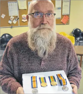  ?? SALLY COLE/THE GUARDIAN ?? P.E.I. resident Leo Cheverie shows the medals that were awarded to his great-uncles, Thomas Vincent Holland and Joseph Holland, for their service during the First World War. They were both killed in 1918, in the last 100 days of the war.