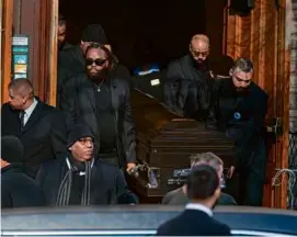  ?? NATHAN KLIMA FOR THE BOSTON GLOBE ?? The casket was carried from St. Paul A.M.E. Church after the funeral of Roderick Jackson.