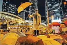  ?? FOTO ČTK/AP ?? Deštníkové hnutí protestova­lo v Hongkongu v roce 2014