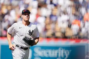  ?? The Associated Press ?? ■ New York Yankees’ Aaron Judge, left, runs in the outfield during batting practice before the 2022 MLB All-Star game Monday in Los Angeles.