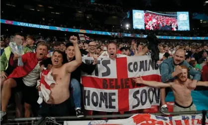  ?? Photograph: Tom Jenkins/The Guardian ?? England fans celebrate wildly at the final whistle.