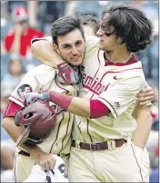  ?? WADE PAYNE / THEACC.COM ?? FSU infielder Drew Mendoza (right) celebrates with Alec Byrd after hitting a home run in the ACC championsh­ip game in Louisville, Ky., on Sunday.