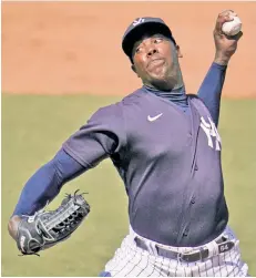  ?? AP ?? GETTING LOOSE: Aroldis Chapman delivers a pitch during the fifth inning of the Yankees’ exhibition game against the Pirates at Steinbrenn­er Field.