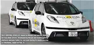  ??  ?? SELF-DRIVING VEHICLES, based on Nissan Leaf electric vehicle, for Easy Ride service, developed by Nissan and mobile gaming platform operator DeNA Co., are seen during its media preview in Yokohama, Japan on Feb. 21.