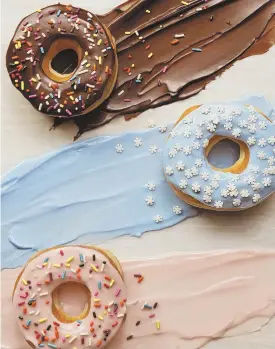  ?? PhotoCourt­esyofDunki­n’Donuts ?? NEW COLORS: Dunkin’ removed artificial dyes from its doughnuts.