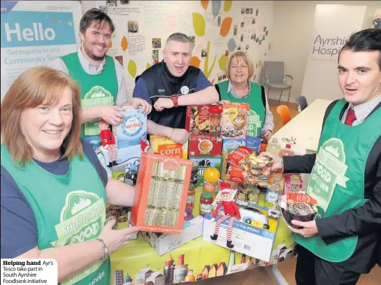  ??  ?? Helping hand Ayr’s Tesco take part in South Ayrshire Foodbank initiative