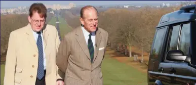  ??  ?? Tour: Robert with Prince Philip, then in his 80s, next to the Duke’s own Land Rover