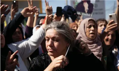  ?? Photograph: Reuters ?? A woman cuts her hair during a protest over the death of Mahsa Amini in the Kurdish-controlled city of Qamishli in northeaste­rn Syria.