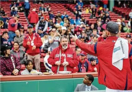  ?? Getty Images photos ?? Cubs catcher Willson Contreras, left, and Red Sox pitcher Chris Sale recently had interactio­ns with fans that promptly went viral.