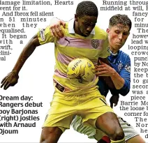  ??  ?? Dream day: Rangers debut boy Barjonas (right) jostles with Arnaud Djoum