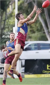  ??  ?? Warragul Industrial­s player Cooper Minichiell­o flys for the mark.
