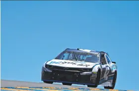  ?? Robert Reiners / Getty Images ?? Kyle Larson, driving this DC Solar Chevrolet, was top qualifier at 94.597 mph for the NASCAR Cup Series Toyota/Save Mart 350.