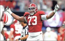  ?? Todd Kirkland/Getty images north america/Tns ?? Evan Neal (73) of the Alabama Crimson Tide reacts after an Alabama touchdown in the second quarter of the SEC Championsh­ip game against the Georgia Bulldogs at Mercedes-Benz Stadium on Dec. 4, 2021, in Atlanta.