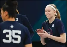  ?? (AP/Eric Gay) ?? UConn’s Paige Bueckers (right) practices before the team’s Final Four game today against Stanford. UConn and Stanford are led by hall of fame coaches, and when it comes to the big stage, the two programs know each other all too well.