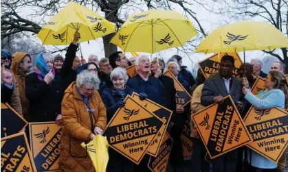  ?? Photograph: Dan Kitwood/Getty Images ?? Lib-Dem supporters wait in the rain for the arrival of party leader Ed Davey, Guildford, 3 January 2024.