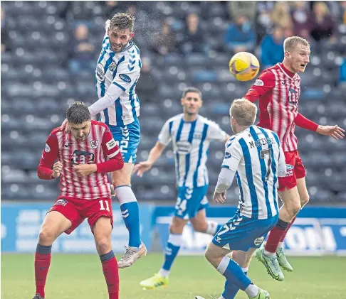  ?? ?? NO WAY THROUGH: Kilmarnock’s Jason Naismith gets in a header during the Rugby Park team’s home loss to Raith.