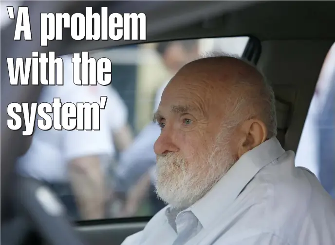  ?? MARY SCHWALM / BOSTON HERALD FILE ?? ‘A PROBLEM WITH THE SYSTEM’: Wayne Chapman sits in the front passenger seat of a vehicle outside of Middlesex Superior Court on Friday in Woburn.