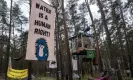  ?? Ebrahim Noroozi/AP ?? A view of tree houses set up by activists near the Tesla Gigafactor­y. Photograph: