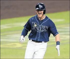  ?? JAE C. HONG/AP ?? The Tampa Bay Rays’ Mike Brosseau, a 2012 Andrean graduate, celebrates after hitting a home run against the Yankees during the eighth inning in Game 5 of the AL Division Series.