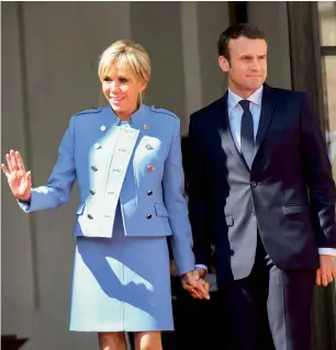  ?? AFP ?? President Emmanuel Macron with wife Brigitte Trogneux at the Elysee Presidenti­al Palace prior to the inaugurati­on ceremony in Paris. —