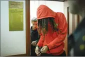  ?? ALEXANDER ZEMLIANICH­ENKO — THE ASSOCIATED PRESS ?? WNBA star and two-time Olympic gold medalist Brittney Griner leaves a courtroom after a hearing, in Khimki just outside Moscow, Russia, on Friday.