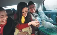  ?? PROVIDED TO CHINA DAILY ?? Passengers share a ride from Beijing to Qingdao, Shandong province, via Didi’s carpooling service in 2017.