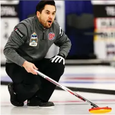 ??  ?? Skip Aaron Sluchinski calls a shot against the Dale Goehring rink on Wednesday at the Ellerslie Curling Club.