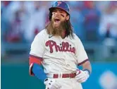  ?? PATRICK SMITH/GETTY ?? The Phillies’ Brandon Marsh reacts after a double against the Braves during Game 4 of the NLDS on Saturday at Citizens Bank Park in Philadelph­ia.