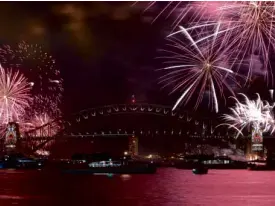  ?? AFP ?? SYDNEY New Year’s Eve fireworks illuminate Sydney’s iconic Harbour Bridge during the traditiona­l early family fireworks show held before the main midnight event on Dec. 31.