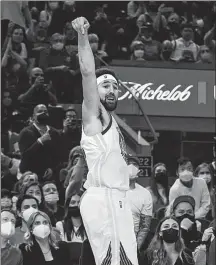  ?? AP ?? Golden State Warriors guard Klay Thompson reacts after scoring a 3-pointer against the Cleveland Cavaliers during an NBA game in San Francisco on Sunday.